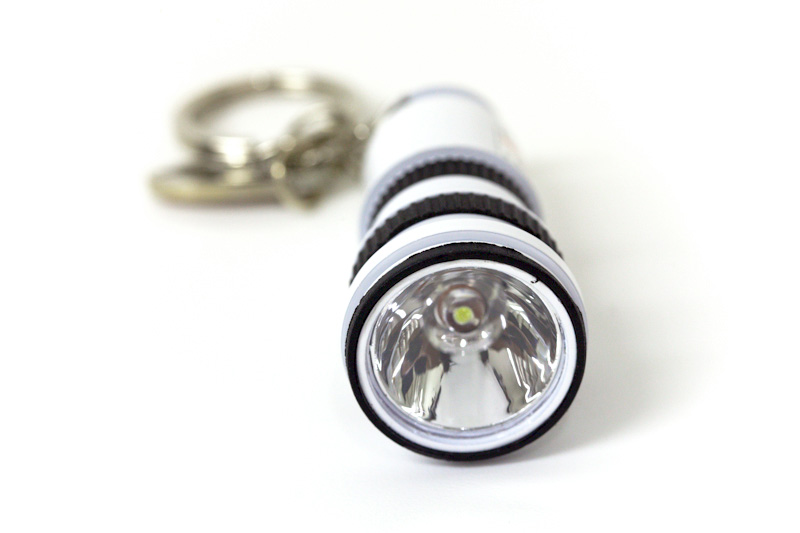 Canon OIS Lens Flashlight Keychain front view
